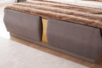 Footboard of Lorenzo Queen Bed in gray with gold center accent and soft fabric texture, complementing luxury bedroom decor.