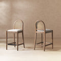 Rattan Counter Stool Set - Panama 26.5', Two-Tone Gray with curved cane backs and cushioned seats in a neutral wool blend, ideal for modern kitchens.