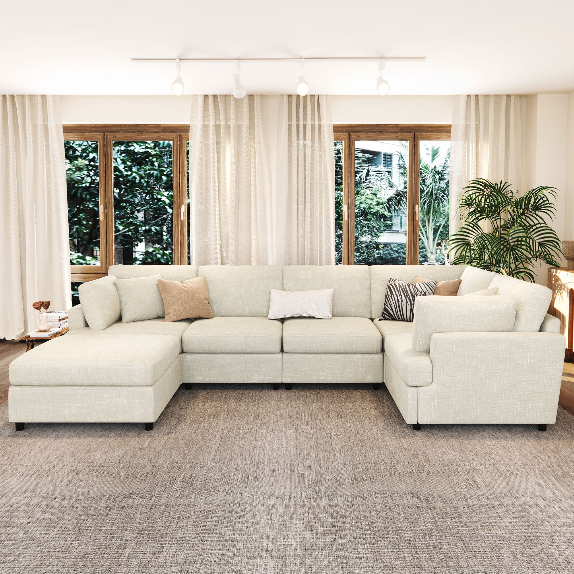 Modular U-shaped sectional sofa with movable ottoman, featuring soft chenille fabric and spacious seating for modern home interiors.