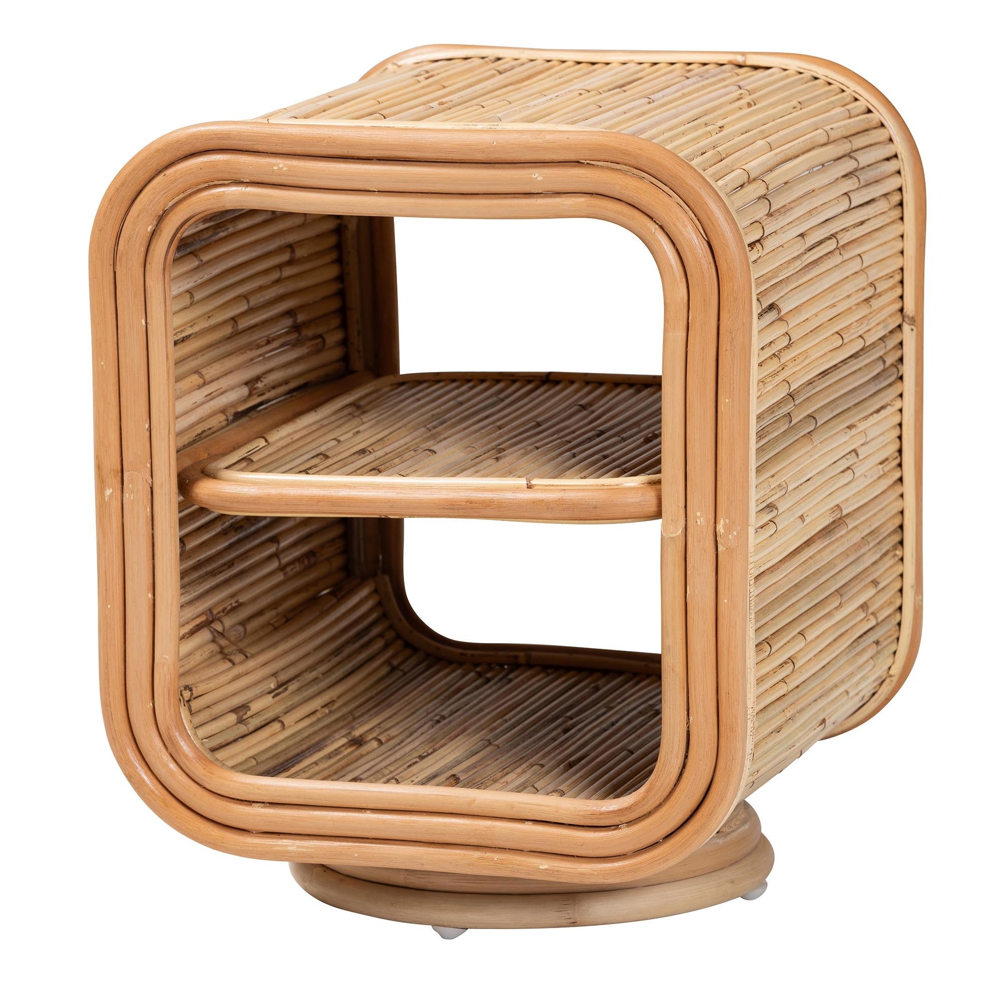 Boho-style natural rattan nightstand with a square, rounded-corner frame and one interior shelf on a pedestal base.