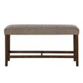 Modern bar-height bench with a heathered brown upholstered seat and dark wood legs with a sturdy crossbar stretcher.