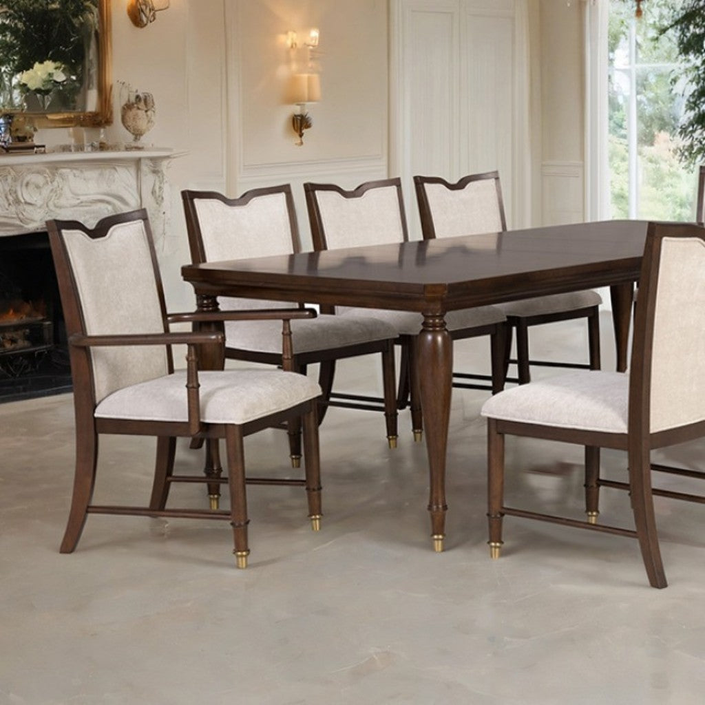Dining room set featuring transitional dining chairs with upholstered seats and solid wood frames around a matching wooden table.
