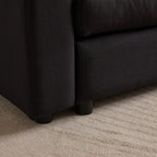 Close-up of sofa leg and fabric texture on modular L-shaped sofa, showing durable construction and modern design.