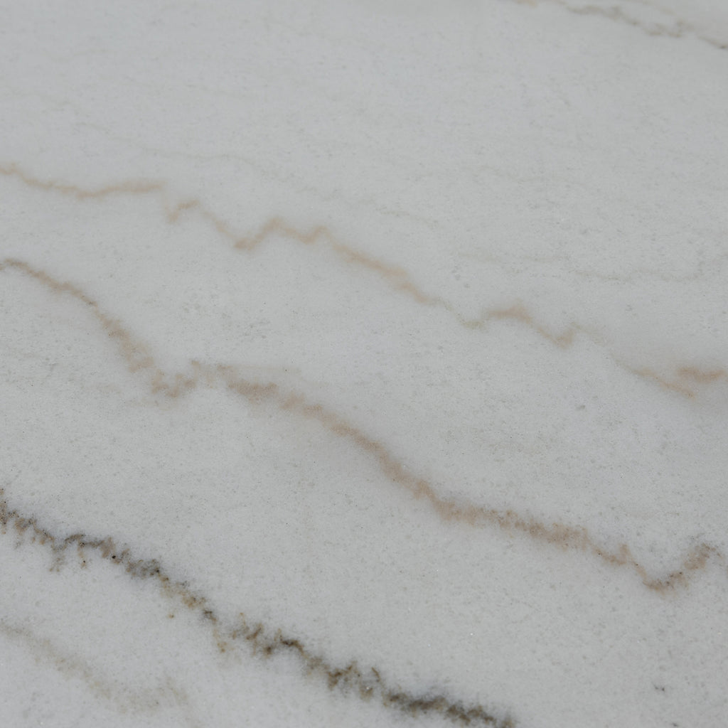 Close-up of the Jasmine Bar Table's grey marble top, highlighting natural veining and smooth surface ideal for elegant dining.