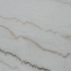 Close-up of the Jasmine Bar Table's grey marble top, highlighting natural veining and smooth surface ideal for elegant dining.