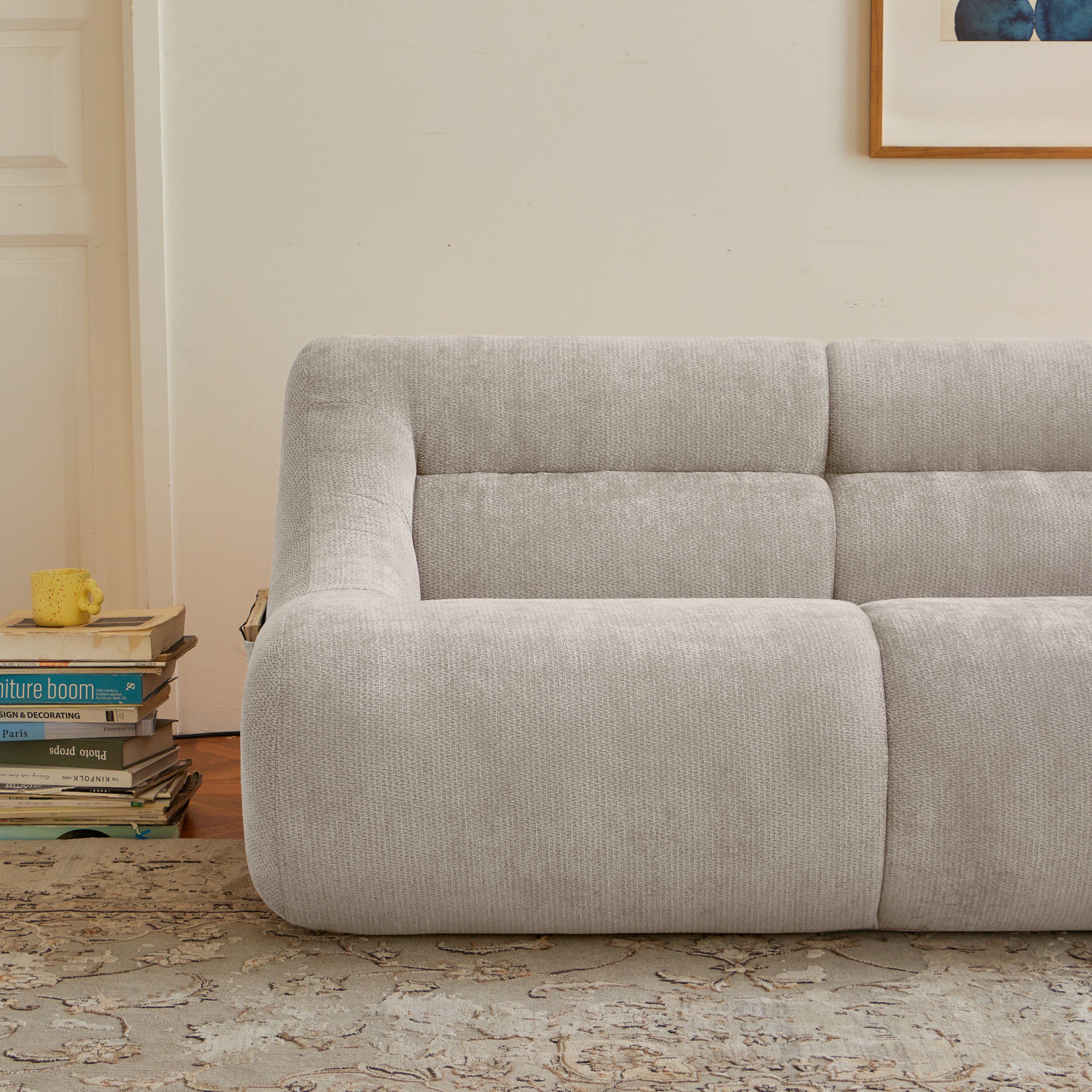 Left-side detail of beige memory foam sofa showing plush chenille texture and ergonomic seating for compact living room comfort.