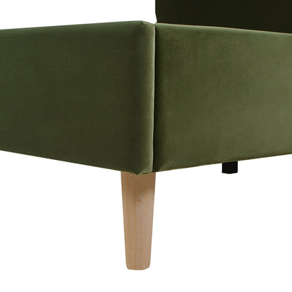 Corner detail of the Stockholm Modern king platform bed with olive green velvet upholstery and tapered wooden leg.