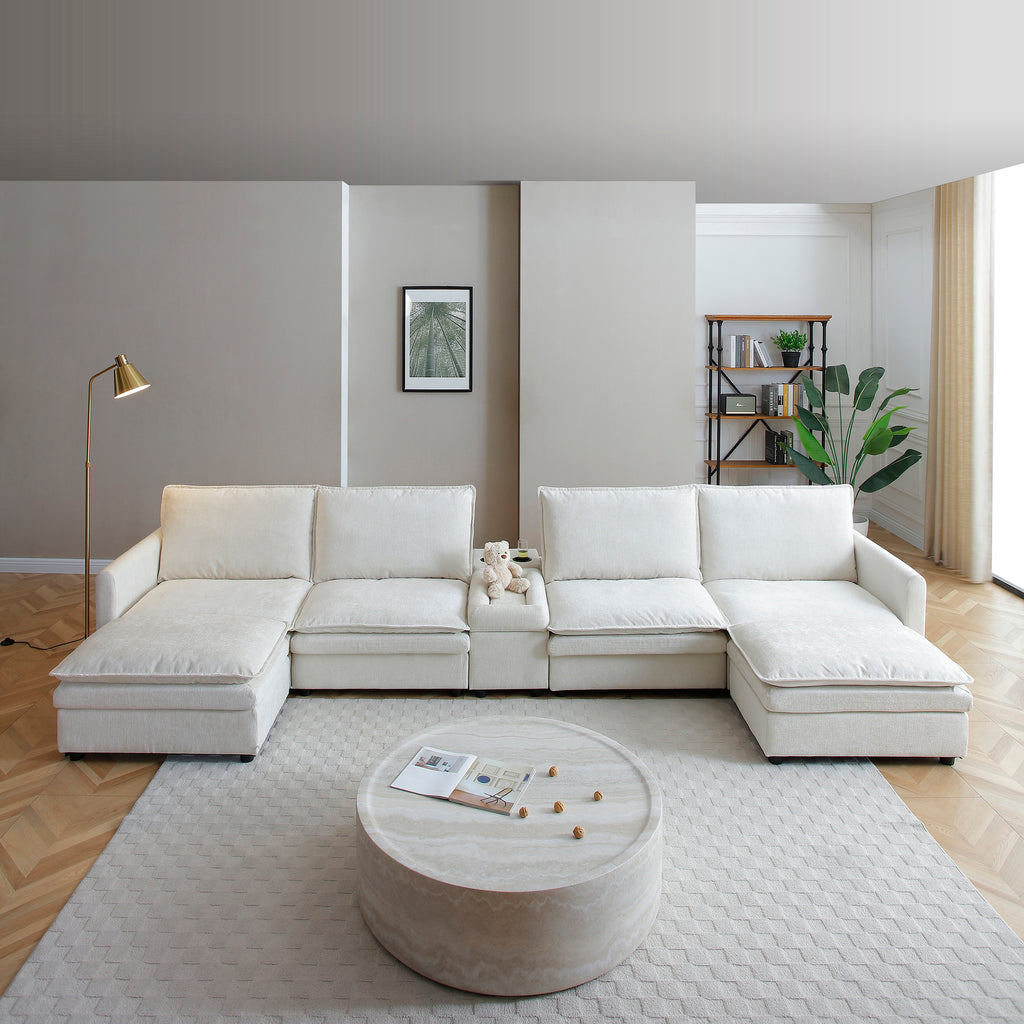 White chenille 6-seater U-shaped modular sectional sofa with deep seats, movable ottomans, and console storage.