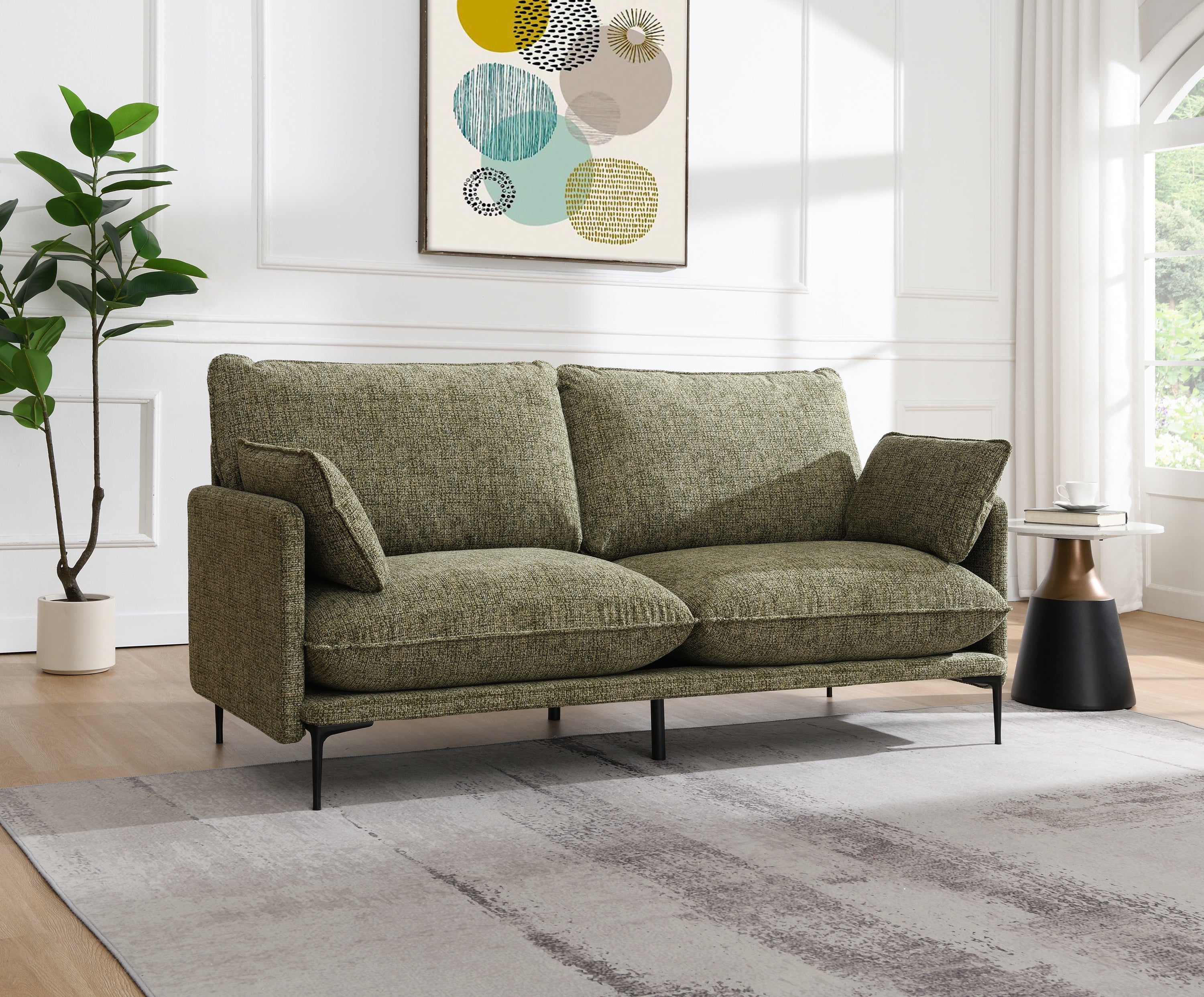 Dalton Green Fabric Sofa - Compressed Cushion in modern living room with tufted cushions, green chenille fabric, and black metal legs.