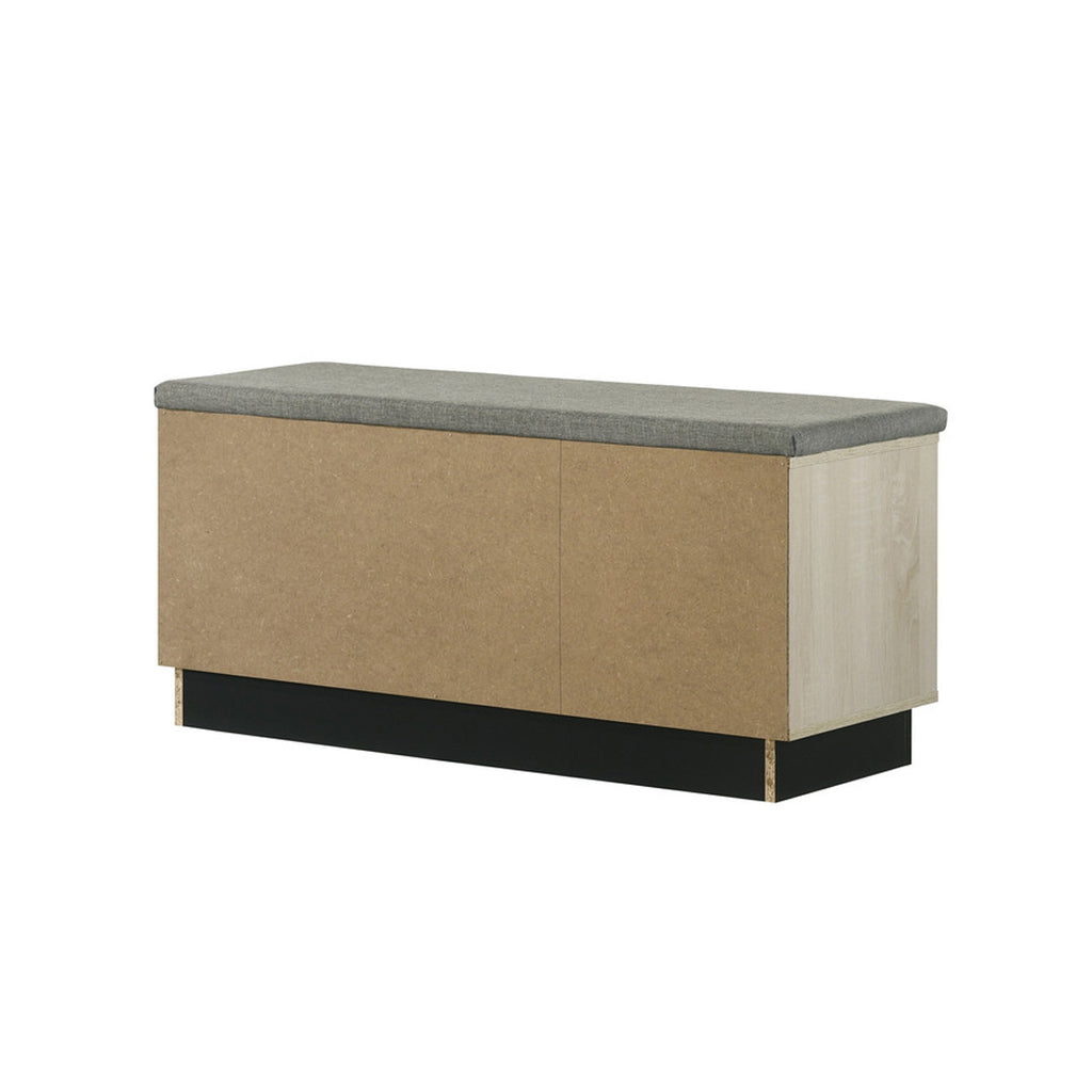 Rear view of oak shoe cabinet with upholstered top, showing solid back panel for stable placement against walls in entryways.