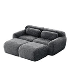 Angled view of Dark Grey Plush Modular Sofa with ergonomic pillows and ottoman, ideal for modern living room comfort.
