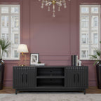 Radiance TV Stand 85 inch TVs - Black Finish in a pink-toned room, showcasing its sleek design and ample storage space.