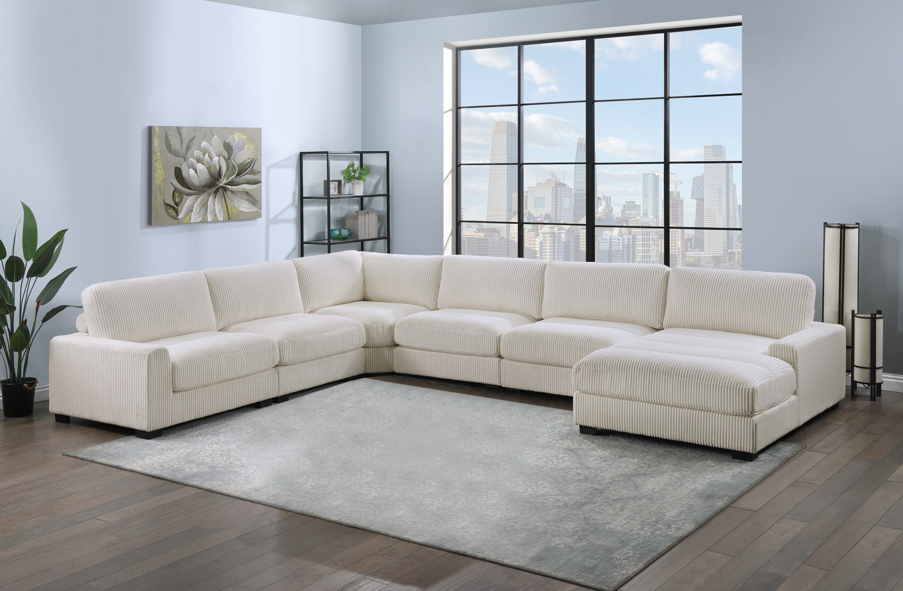 Beige 6-piece modular corduroy sectional sofa with welt detailing, featuring a corner wedge, chaise, and armless chairs.