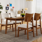 Farmhouse dining table set for 4 with wood frame and upholstered chairs in a modern dining room. Ideal for small spaces and stylish interiors.