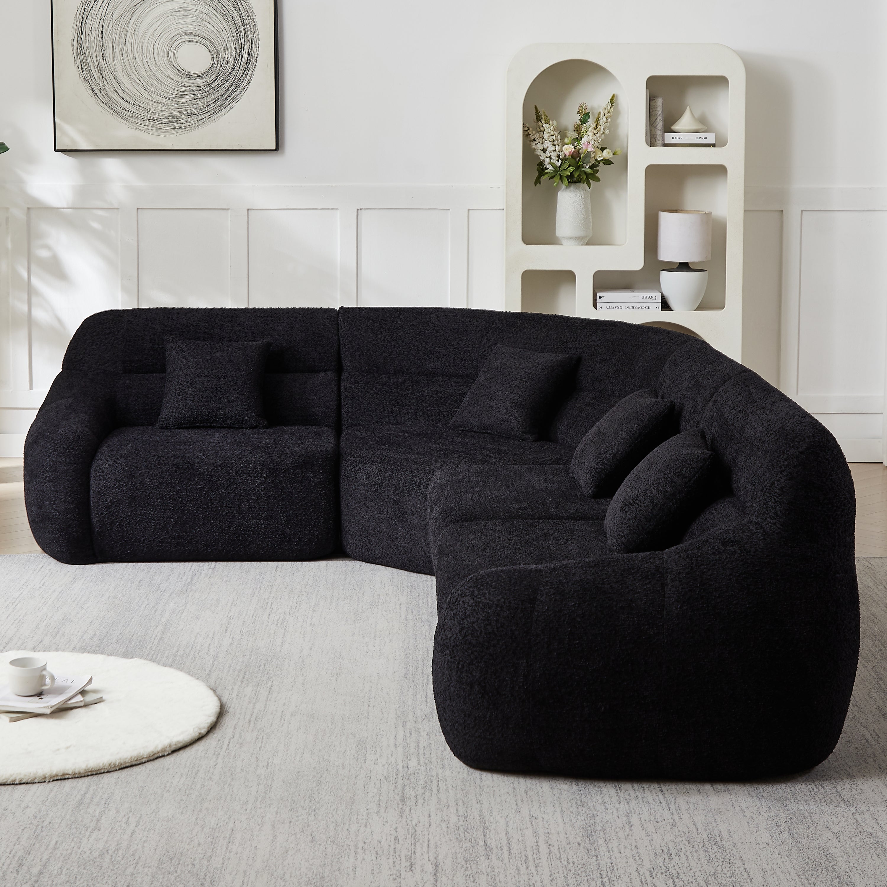 Close-up side view of Luxury Chenille Black Modular Sofa, showcasing its soft texture, deep seating, and modern curved design.