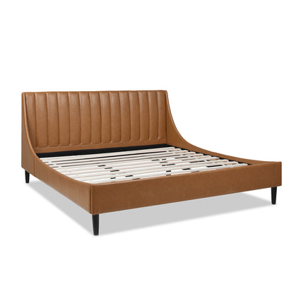 Angled view of Aspen king faux leather platform bed with vertical tufted headboard and exposed wooden slats.