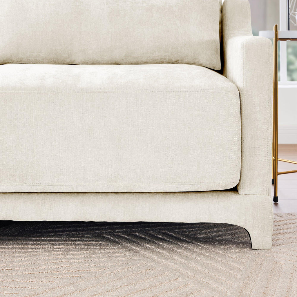 Beige Chenille Four-Seater Sofa with Ottoman Pillow.