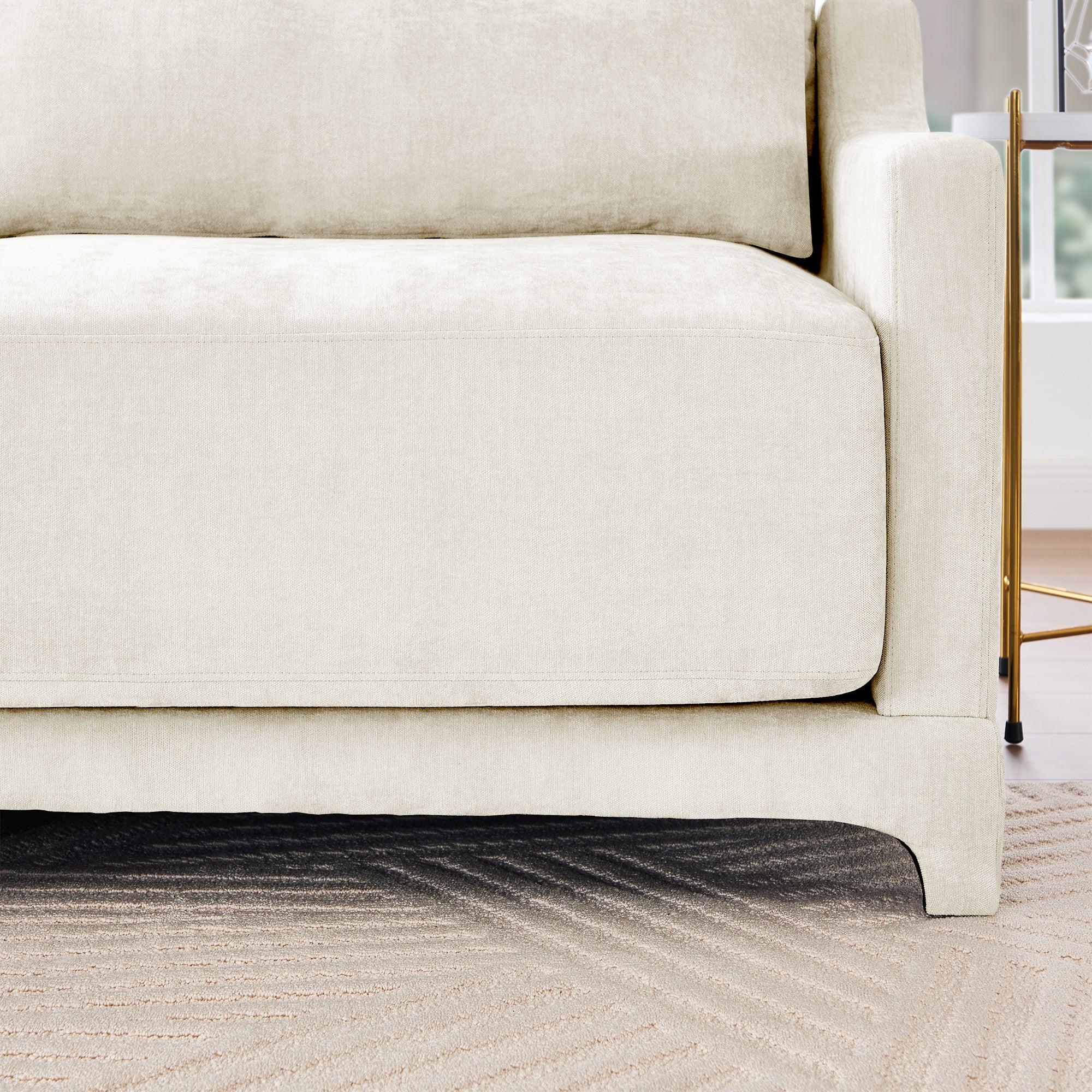Beige Chenille Four-Seater Sofa with Ottoman Pillow.