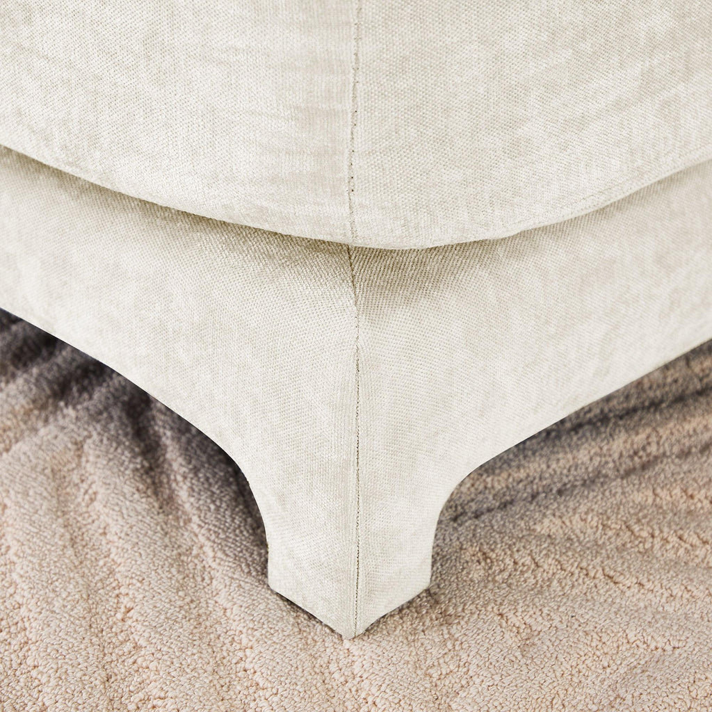 Beige Chenille Four-Seater Sofa with Ottoman Pillow.