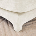 Beige Chenille Four-Seater Sofa with Ottoman Pillow.