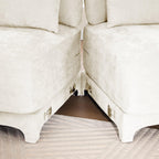 Beige Chenille Four-Seater Sofa with Ottoman Pillow.