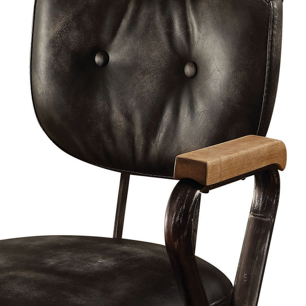 Detail of tufted leather backrest and wooden armrest on the Vintage Black Swivel Office Chair, showcasing craftsmanship and comfort.