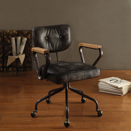 Vintage Black Swivel Office Chair with leather seat, nailhead trim, and wooden armrests in a home office setting. Features tufted back and 5-star base.