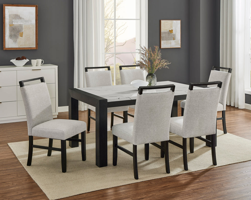 Dining room with a black table and gray chairs on a beige rug.