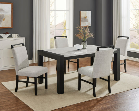 Dining room with a black and white table and chairs in a well-lit room.