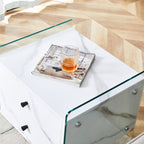 Double-drawer bedside table. The board surface is MDF sticker, and both sides are transparent tempered glass. The design is simple and elegant, with excellent storage functions.