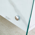 Double-drawer bedside table. The board surface is MDF sticker, and both sides are transparent tempered glass. The design is simple and elegant, with excellent storage functions.