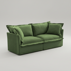 Green sofa with cushions on a gray background