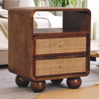 Wooden side table with wicker drawers in a living room setting