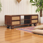 Wooden TV stand with woven drawers in a living room setting