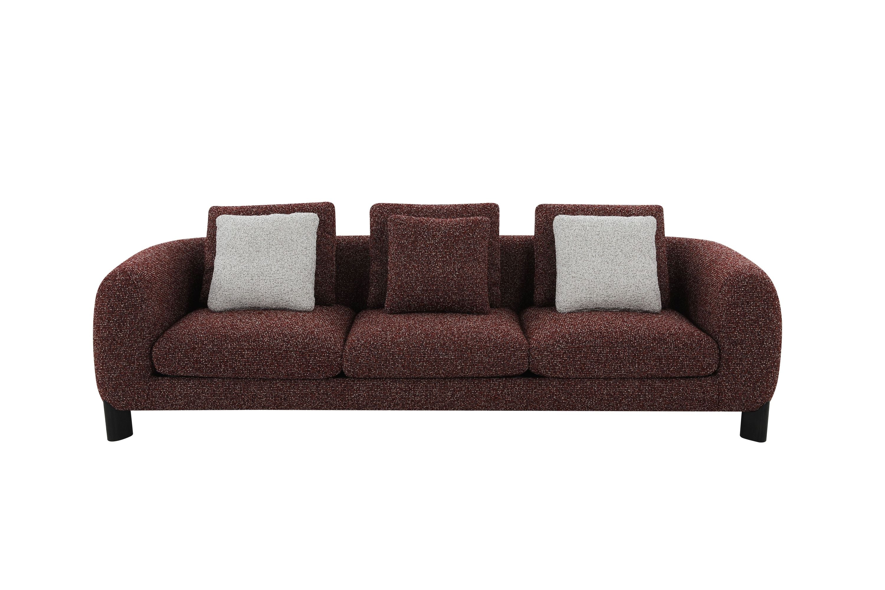 Brown and cream sofa with gray cushions on a white background