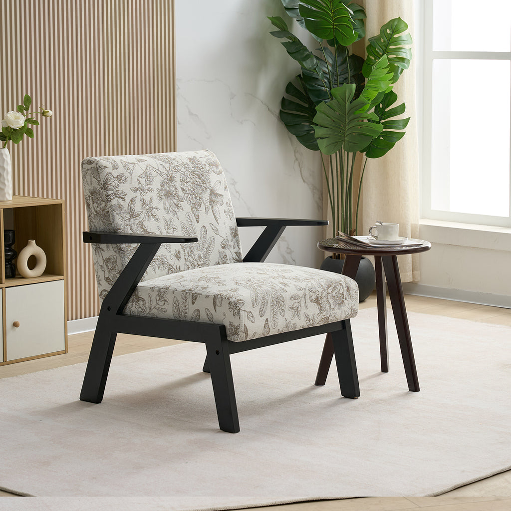 Patterned armchair in a modern living room with a side table and plant.