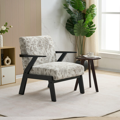 Patterned armchair in a modern living room with a side table and plant.