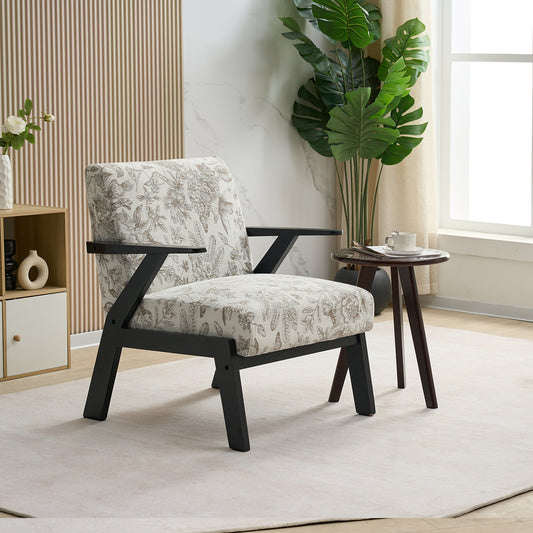 Patterned armchair in a modern living room with a side table and plant.