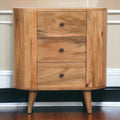 Wooden cabinet with three drawers against a neutral wall.