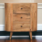 Wooden cabinet with three drawers against a neutral wall.