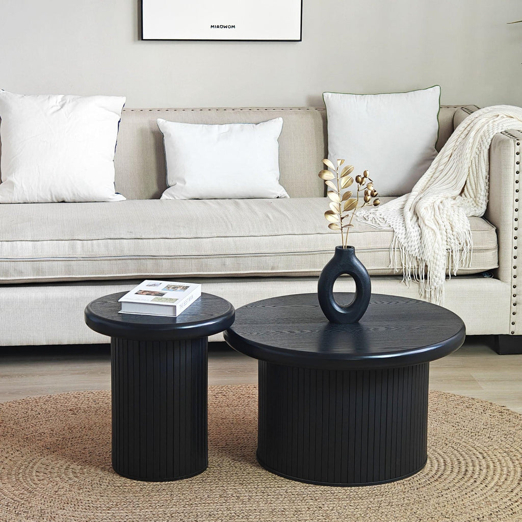 Modern Black Round Coffee Table With Fluted Legs.