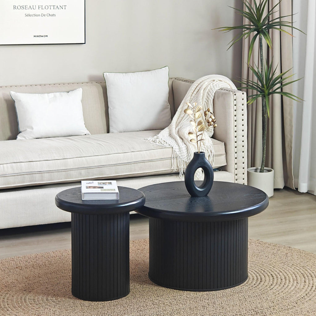 Modern Black Round Coffee Table With Fluted Legs.