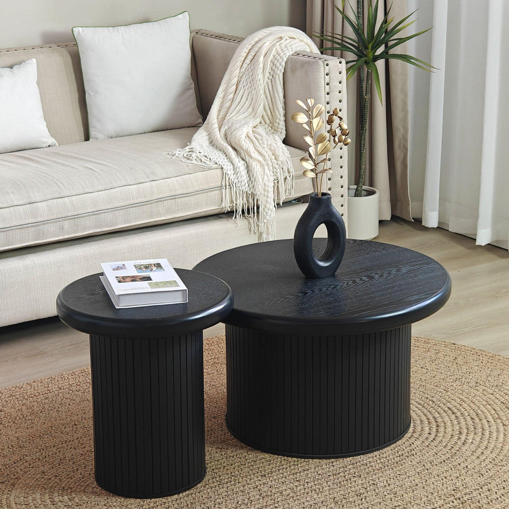 Modern Black Round Coffee Table With Fluted Legs.