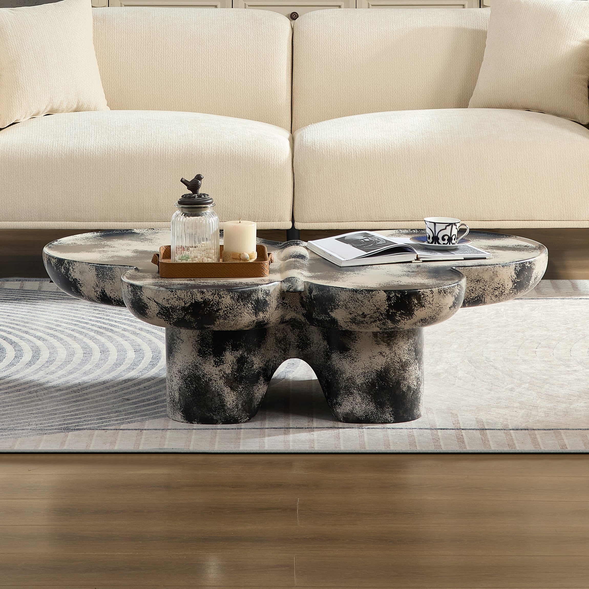 Butterfly design style, coffee table, imitation natural limestone material, suitable for living room/office, fiberglass, black and beige combination.