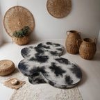 Butterfly design style, coffee table, imitation natural limestone material, suitable for living room/office, fiberglass, black and beige combination.