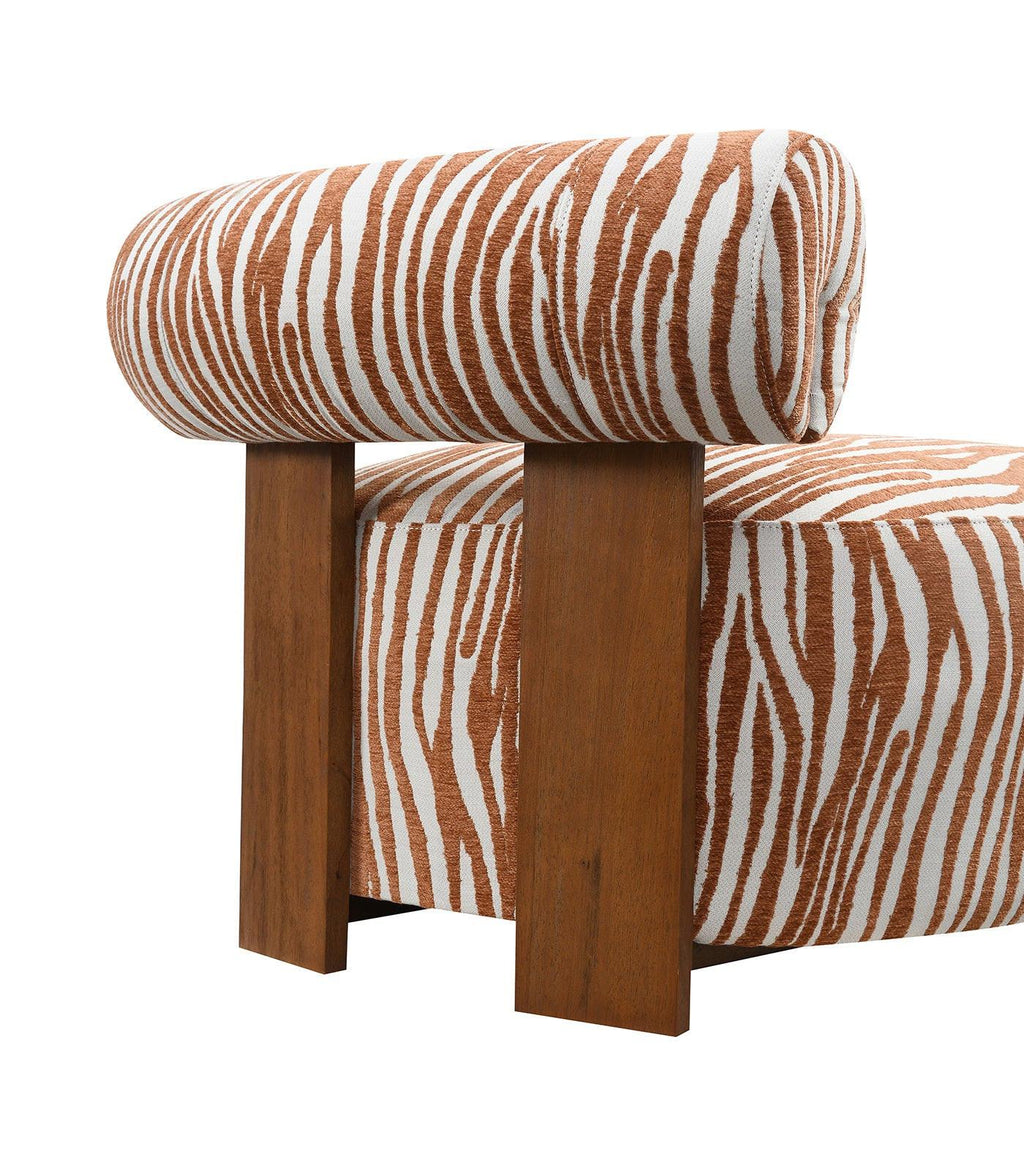 Chair with zebra print upholstery and wooden legs on a white background