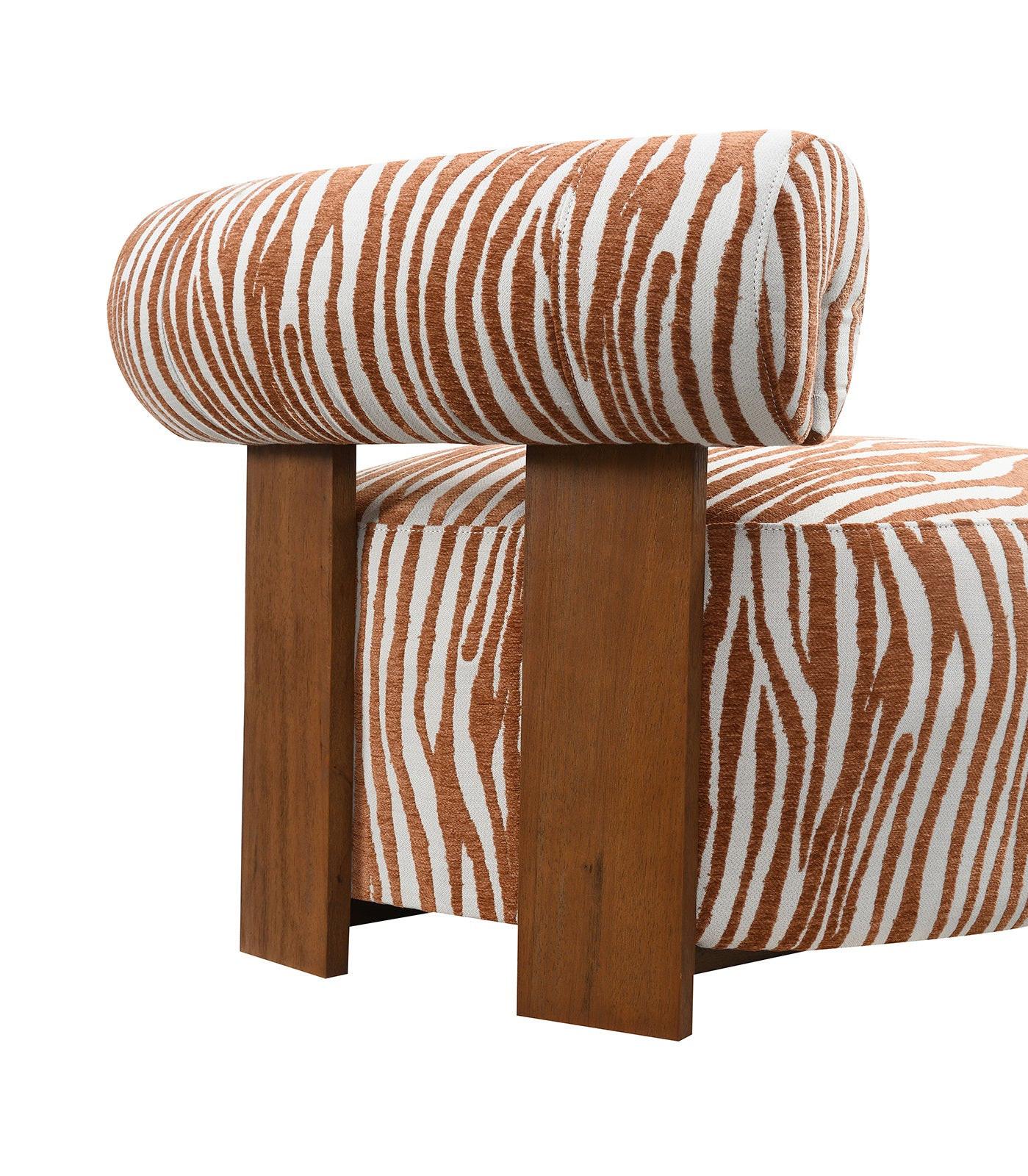 Chair with zebra print upholstery and wooden legs on a white background