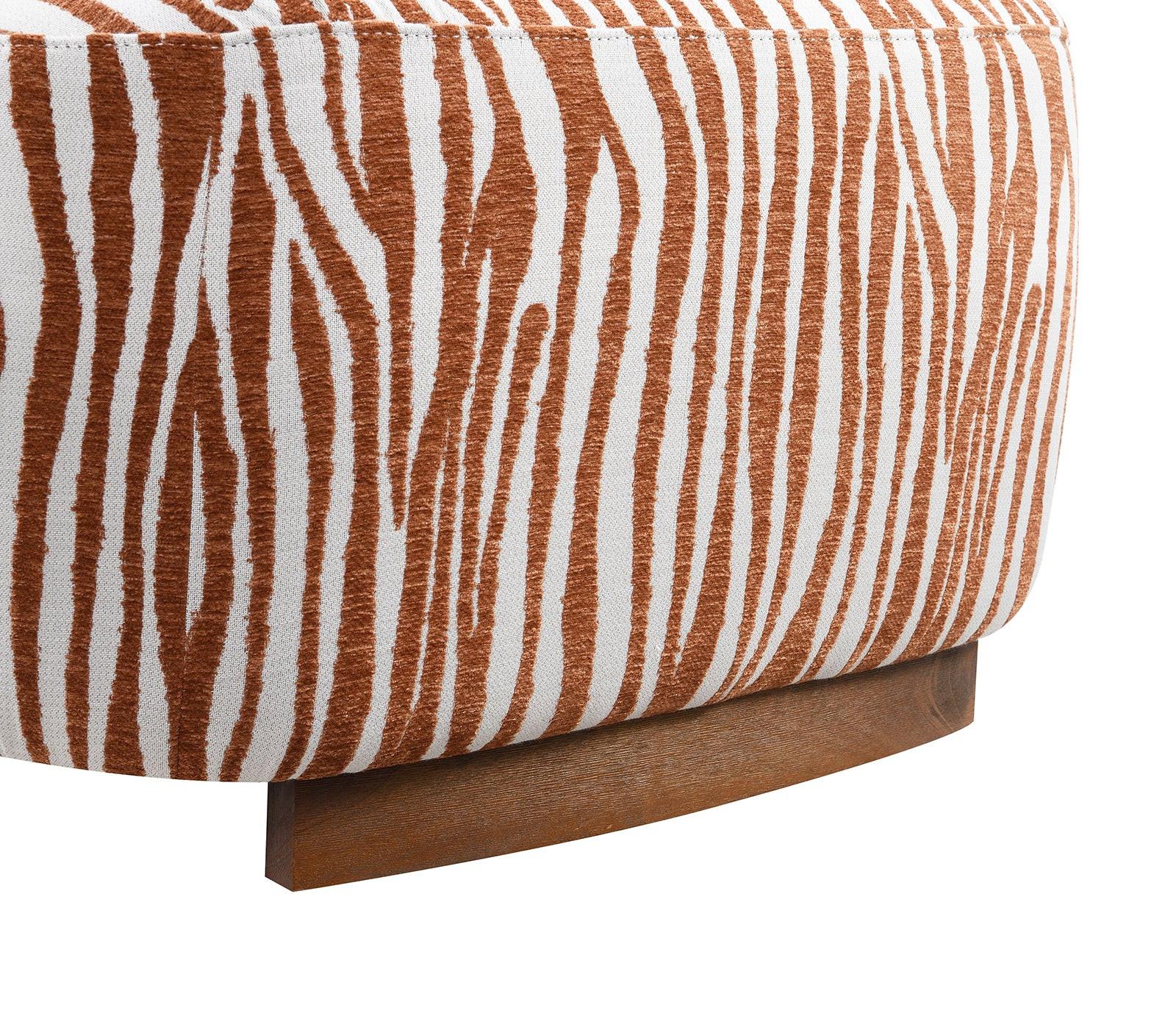 Cylindrical ottoman with brown and white striped pattern and wooden base on a white background