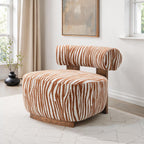 Chair with zebra print pattern in a room with light-colored walls and flooring.