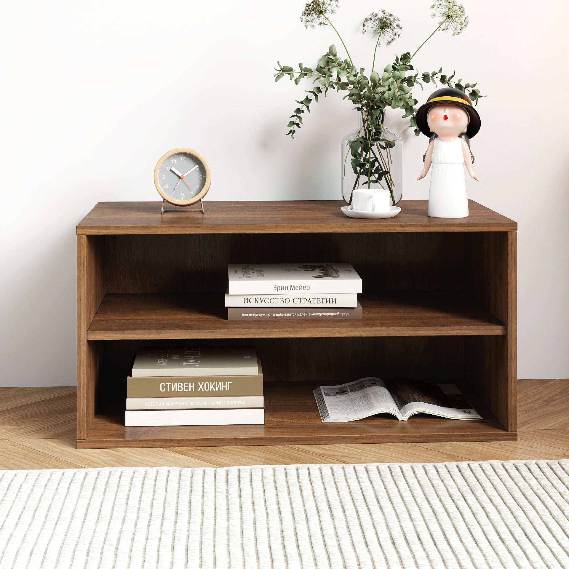 Wooden shelf with books, a clock, and decorative items on a white background